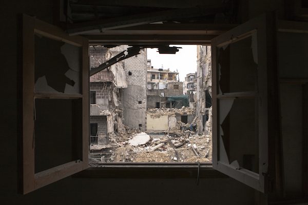 A building that was being used as a makeshift hospital in Aleppo. Picture taken from across the street from the upper floor of a now abandoned residential block. © Richard Harvey | dreamstime.com