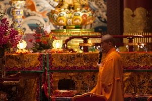 Monk chanting in the Buddhist Tooth Relic Temple of Singapore. In recent years the number of Buddhists in Singapore has dropped, while more people have identified themselves as Taoists. © Iryna Rasko I Dreamstime.com