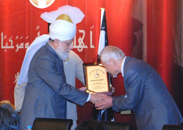 Mr Akio Najima, Prominent Lawyer and Human Rights Activist greeting His Holiness Mirza Masroor Ahmad