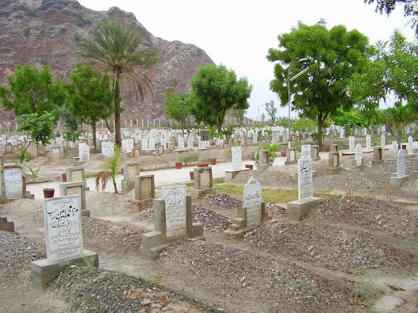 According to the Founder of the Ahmadiyya Muslim Community, a holy person maintains a connection with the grave and this material world for a few days after death. However the soul still immediately reaches its destination at death and does not remain in the body. Photo: General photo of the Bahishti Maqbara, Ahmadiyya Muslim Community Graveyard in Rabwah, Pakistan.