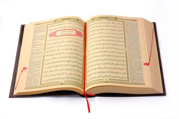 In Islam, Surah Yasin (Chapter 36 of the Holy Qur’an) is recited near to a dying person to comfort him. Photo: Surah Yasin of the Qur’an shown here. © Adem Demir | shutterstock.com