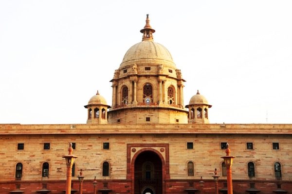 During the British Raj in India, the palatial British homes compared to the primitive huts of the natives highlighted the injustice and inequality in society. © Mikadun | Shutterstock.com