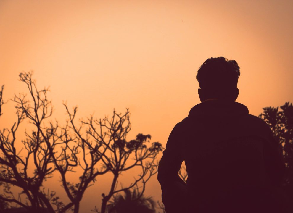 Disappointment Expectation Resilience and Spirituality. Man sitting alone and reflecting.